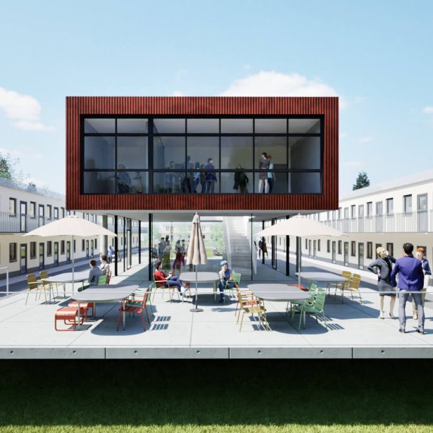 Frontalansicht des neuen Begegnungshauses mit Terrasse und den bestehenden Gebäudeflügeln